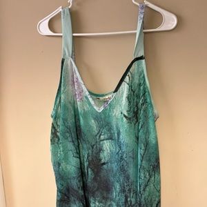 Jiali XXL. Shark bite, sheer, and light green with darker accent of purple.